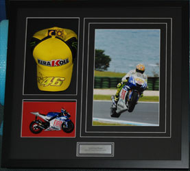 Signed hat and model bike